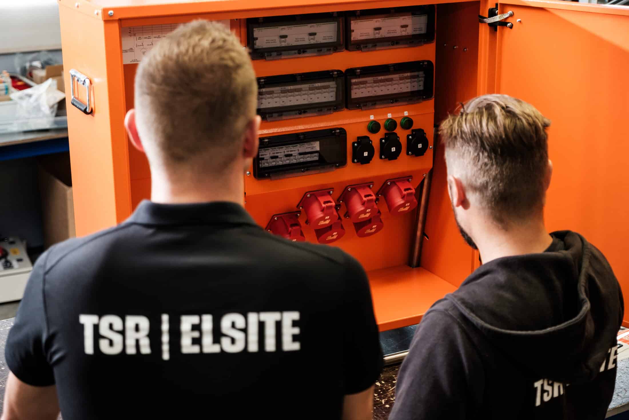 TSR-ELSITE experts inspecting a distribution board – come meet our team at FinnBuild 2026